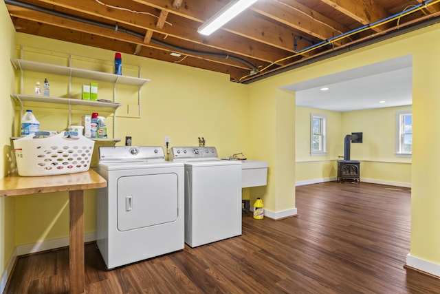 14 Merriconeag Ln, Harpswell, ME 04079 - laundry room with washing machine and clothes dryer, a wood stove, baseboards, dark wood-style flooring, and recessed lighting
