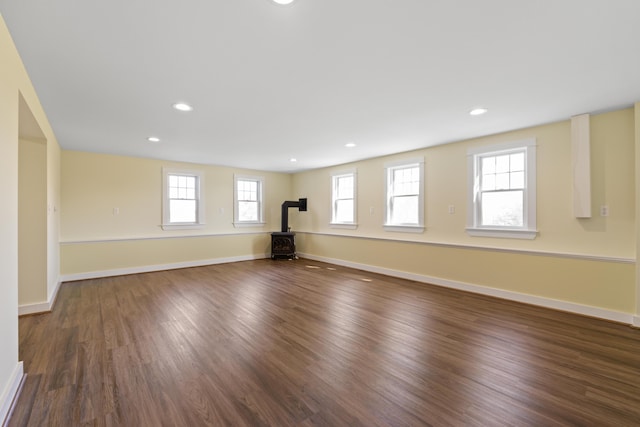 14 Merriconeag Ln, Harpswell, ME 04079 - empty room with a wood stove, wood finished floors, baseboards, and recessed lighting