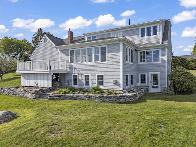 14 Merriconeag Ln, Harpswell, ME 04079 - back of house with a chimney, a lawn, roof with shingles, and a wooden deck