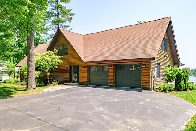 147 Sand Bar Rd, Windham, ME 04062 - view of front of property featuring a garage, asphalt driveway, roof with shingles, and log veneer siding