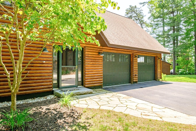 147 Sand Bar Rd, Windham, ME 04062 - view of front facade with a shingled roof, asphalt driveway, and a garage
