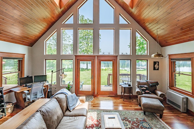 147 Sand Bar Rd, Windham, ME 04062 - living area with high vaulted ceiling, wood-type flooring, and heating unit