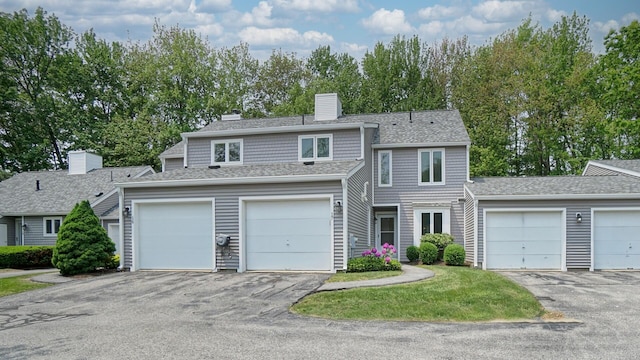 17 Cammock Rd Unit 17, Scarborough, ME 04074 - view of front of home featuring a chimney, driveway, and a shingled roof