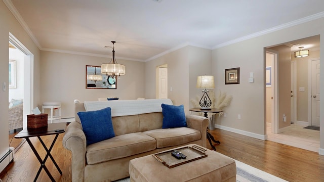 17 Cammock Rd Unit 17, Scarborough, ME 04074 - living room with light wood-style floors, crown molding, baseboards, a chandelier, and baseboard heating