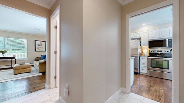 17 Cammock Rd Unit 17, Scarborough, ME 04074 - hallway with ornamental molding, baseboards, and a baseboard radiator