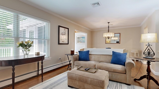 17 Cammock Rd Unit 17, Scarborough, ME 04074 - living area featuring a baseboard heating unit, wood finished floors, ornamental molding, and a chandelier