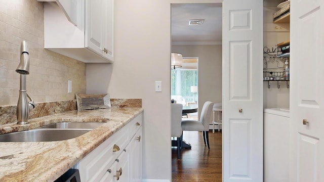 17 Cammock Rd Unit 17, Scarborough, ME 04074 - kitchen featuring a sink, crown molding, white cabinetry, light stone counters, and backsplash