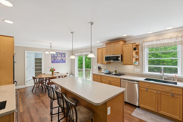 26 Serenity Ln, Topsham, ME 04086 - kitchen with appliances with stainless steel finishes, a sink, light countertops, a center island, and crown molding