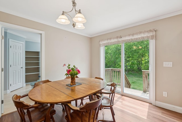 26 Serenity Ln, Topsham, ME 04086 - dining room with a chandelier, light wood finished floors, baseboards, and ornamental molding