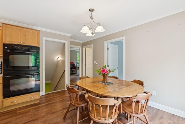 26 Serenity Ln, Topsham, ME 04086 - dining room with a chandelier, wood finished floors, crown molding, and baseboards