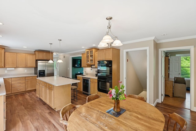 26 Serenity Ln, Topsham, ME 04086 - kitchen with stainless steel fridge, wine cooler, wood finished floors, light countertops, and glass insert cabinets