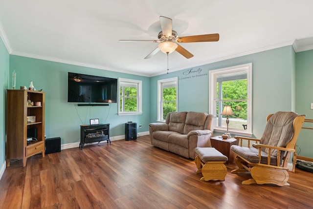 26 Serenity Ln, Topsham, ME 04086 - living area with wood finished floors, healthy amount of natural light, a ceiling fan, and ornamental molding