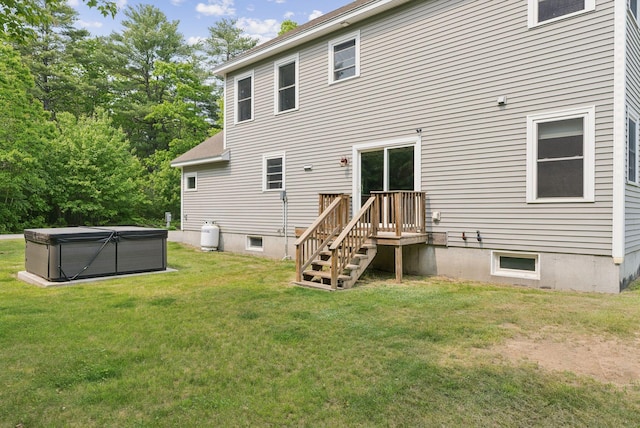 26 Serenity Ln, Topsham, ME 04086 - rear view of house featuring a hot tub and a lawn