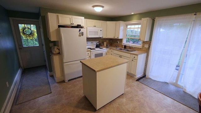 23 Rudman Rd, Portland, ME 04102 - kitchen featuring white appliances, baseboard heating, a center island, white cabinets, and a sink
