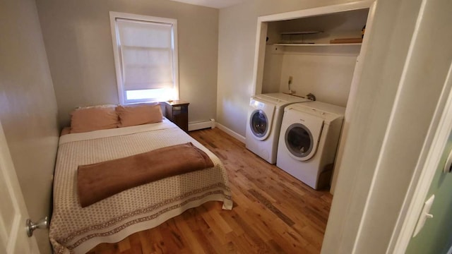 23 Rudman Rd, Portland, ME 04102 - laundry area featuring independent washer and dryer, light wood-type flooring, baseboard heating, and baseboards