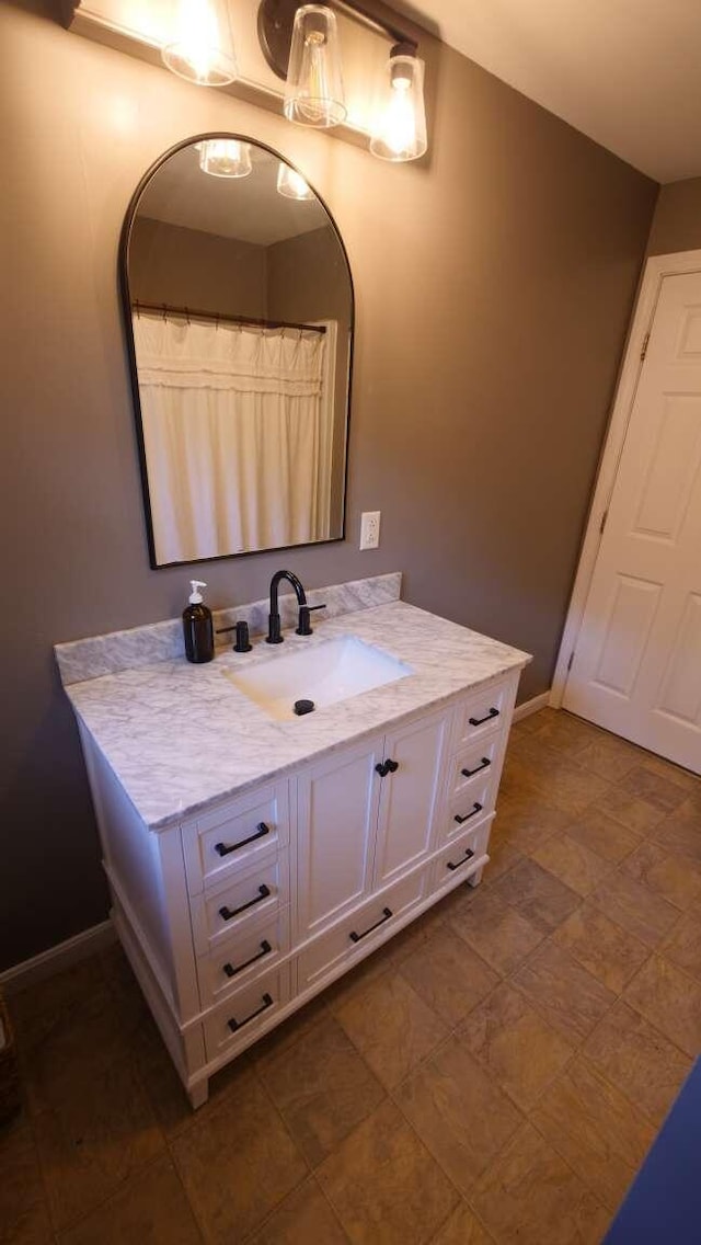23 Rudman Rd, Portland, ME 04102 - bathroom featuring vanity and baseboards