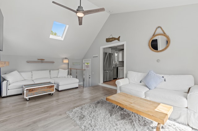 27 Seaside Ave, Saco, ME 04072 - living room with a skylight, ceiling fan, light wood-style floors, and high vaulted ceiling