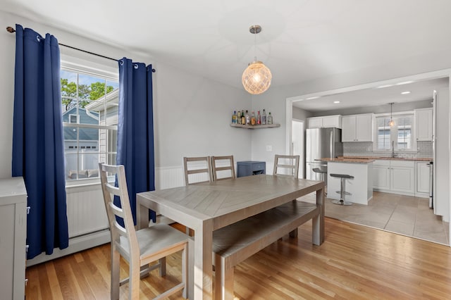 27 Seaside Ave, Saco, ME 04072 - dining room featuring light wood finished floors and baseboard heating