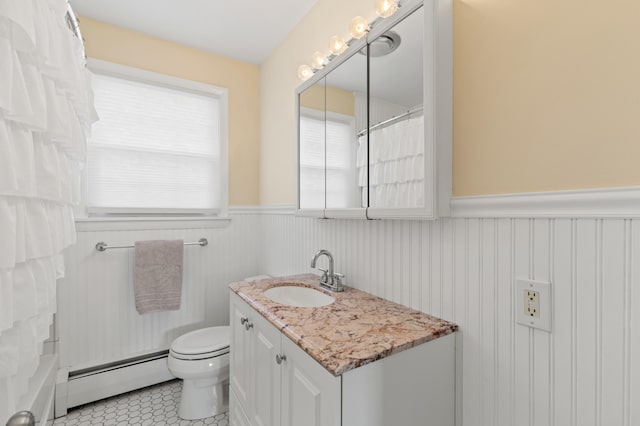 27 Seaside Ave, Saco, ME 04072 - full bathroom featuring a baseboard radiator, a wainscoted wall, vanity, tile patterned floors, and a shower with shower curtain