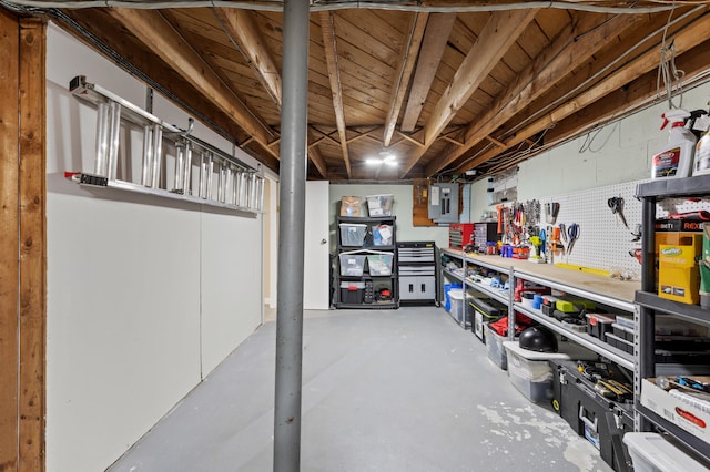 27 Seaside Ave, Saco, ME 04072 - unfinished below grade area with a workshop area and electric panel