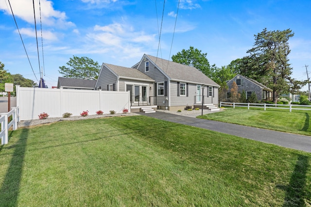 27 Seaside Ave, Saco, ME 04072 - rear view of property featuring a fenced backyard, roof with shingles, and entry steps