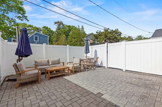 27 Seaside Ave, Saco, ME 04072 - fenced backyard with a patio area and outdoor lounge area