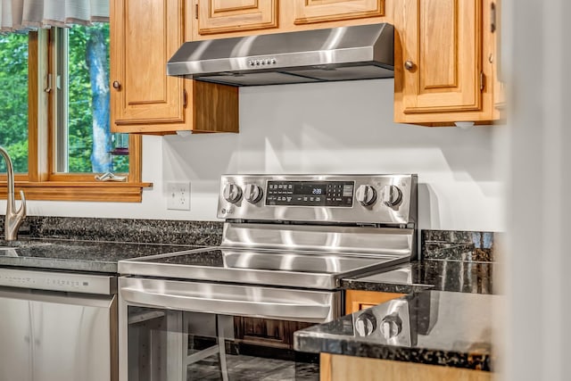 60 Evergreen Dr, Hermon, ME 04401 - kitchen featuring appliances with stainless steel finishes, range hood, dark countertops, and marble finish flooring