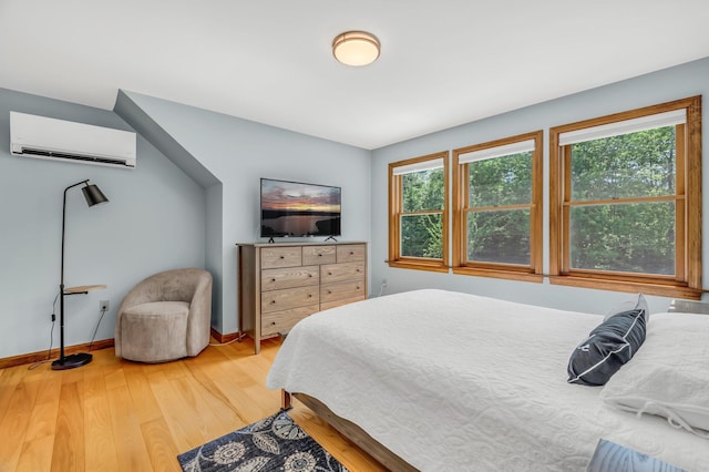 60 Evergreen Dr, Hermon, ME 04401 - bedroom featuring a wall mounted AC and light wood-type flooring
