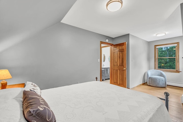 60 Evergreen Dr, Hermon, ME 04401 - bedroom featuring wood finished floors, lofted ceiling, and baseboard heating