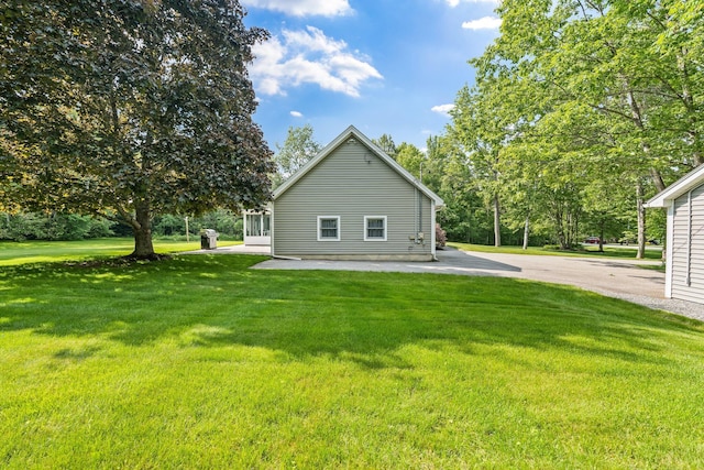 60 Evergreen Dr, Hermon, ME 04401 - rear view of house featuring a lawn