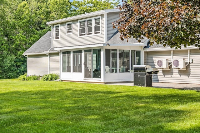 60 Evergreen Dr, Hermon, ME 04401 - back of house featuring a sunroom, a shingled roof, and a lawn