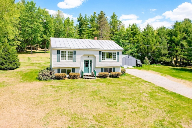 77 Toothaker Pond Rd, Phillips, ME 04966 - bi-level home with a front yard and a chimney