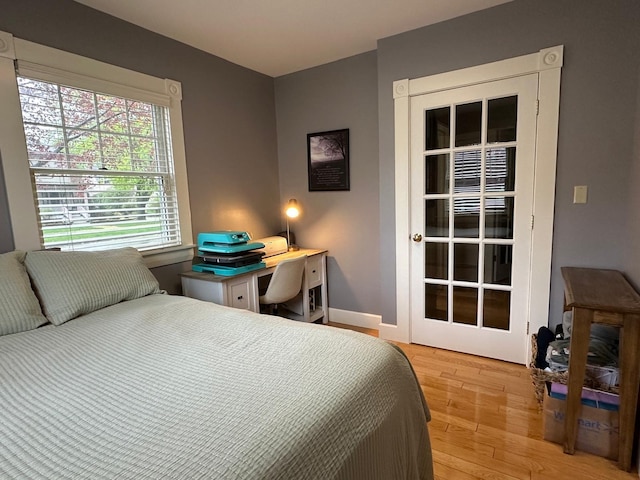 46 3rd St, Presque Isle, ME 04769 - bedroom featuring light wood-style flooring and an office area