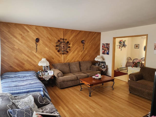 18 Oak St, Jay, ME 04239 - living area with an accent wall, wood walls, and wood finished floors