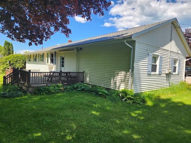 18 Oak St, Jay, ME 04239 - rear view of property featuring a wooden deck, a yard, and a shingled roof