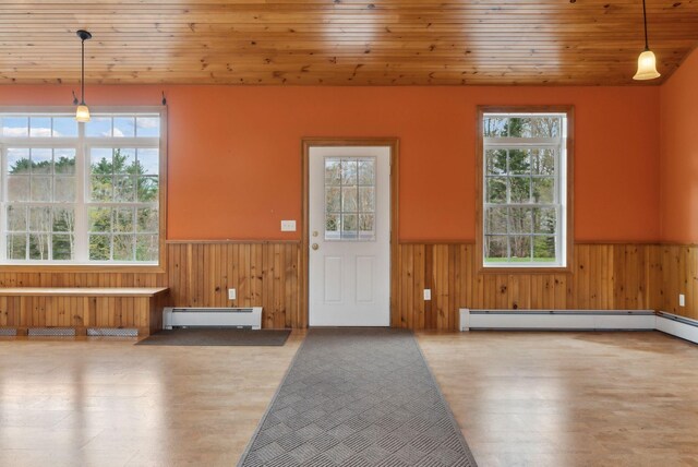 20 Motorcycle Dr, Windham, ME 04062 - entryway with a wainscoted wall, a baseboard heating unit, wood walls, wood finished floors, and wood ceiling