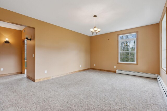 20 Motorcycle Dr, Windham, ME 04062 - unfurnished room with a baseboard radiator, a chandelier, and baseboards