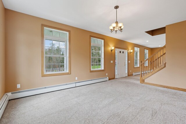 20 Motorcycle Dr, Windham, ME 04062 - unfurnished living room featuring a chandelier, healthy amount of natural light, carpet floors, and stairs
