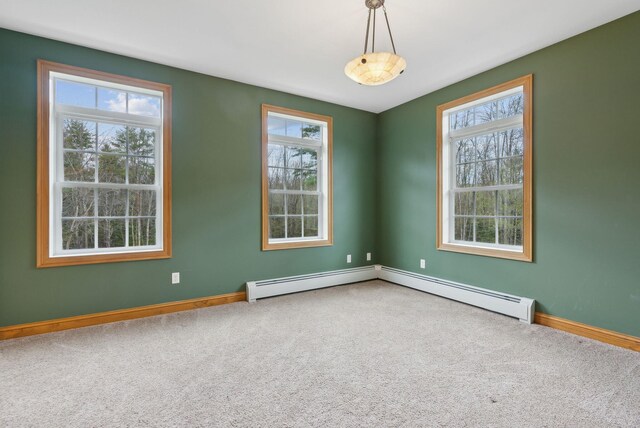 20 Motorcycle Dr, Windham, ME 04062 - carpeted empty room with baseboards, plenty of natural light, and a baseboard radiator