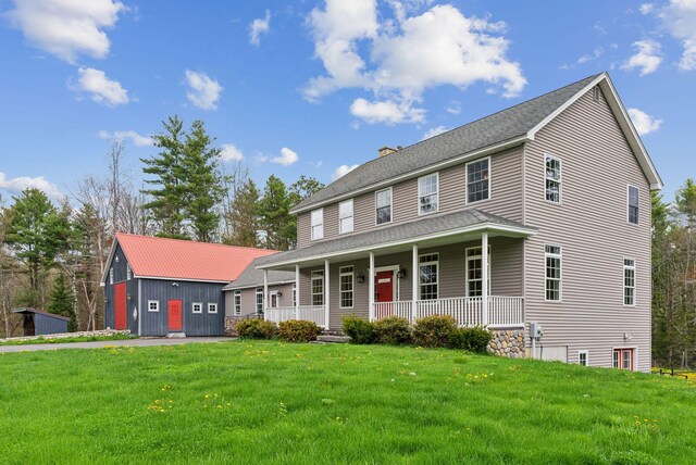 20 Motorcycle Dr, Windham, ME 04062 - view of front of property with a porch, a front lawn, a chimney, and roof with shingles