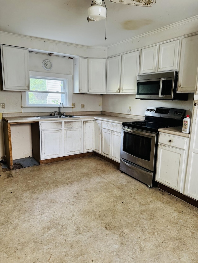 156 Railroad St, Clinton, ME 04927 - kitchen with appliances with stainless steel finishes, a sink, white cabinetry, and light countertops