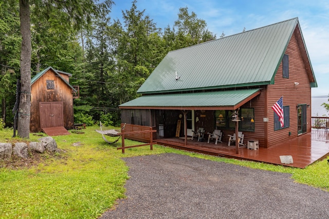 32 Sandy Beach Rd, Danforth, ME 04424 - rear view of property with metal roof