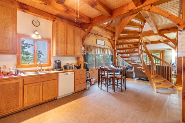 32 Sandy Beach Rd, Danforth, ME 04424 - kitchen featuring white dishwasher, a sink, wood ceiling with exposed beams, and light countertops