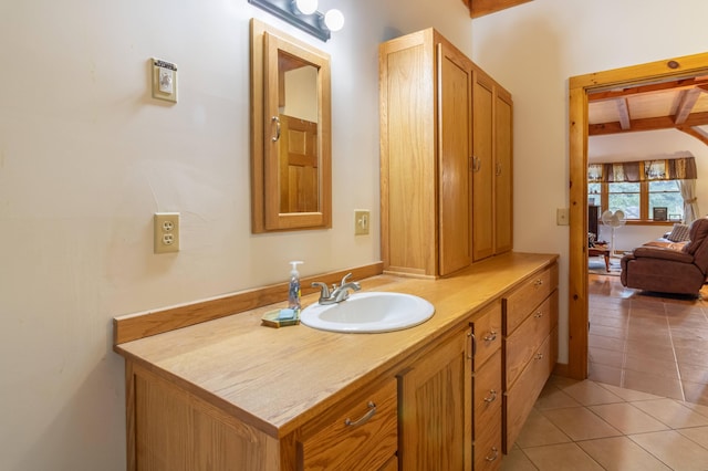 32 Sandy Beach Rd, Danforth, ME 04424 - bathroom with vanity, beam ceiling, and tile patterned flooring