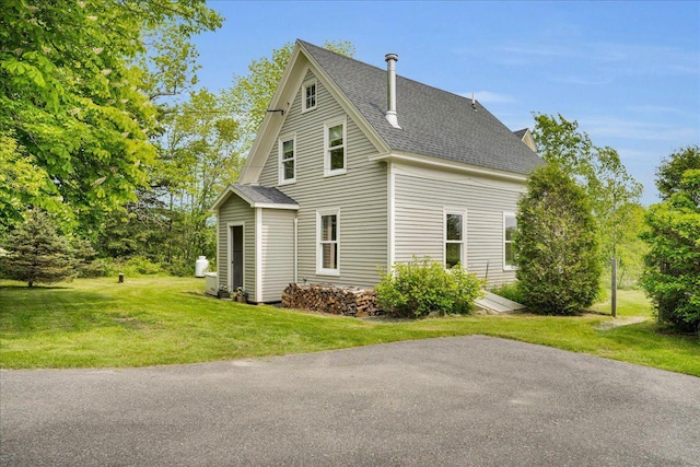 276 N Sedgwick Rd, Sedgwick, ME 04676 - view of property exterior with a shingled roof and a yard