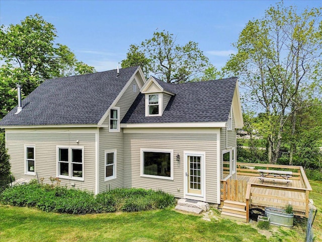 276 N Sedgwick Rd, Sedgwick, ME 04676 - view of front of house with a deck, a front lawn, and roof with shingles