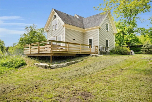 276 N Sedgwick Rd, Sedgwick, ME 04676 - rear view of property with a deck, a yard, and roof with shingles