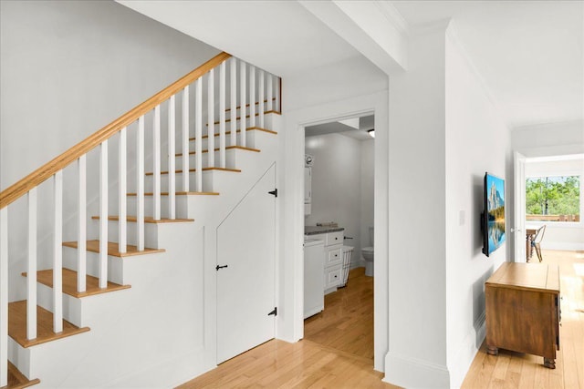 276 N Sedgwick Rd, Sedgwick, ME 04676 - stairs featuring wood finished floors, ornamental molding, and baseboards