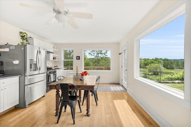 276 N Sedgwick Rd, Sedgwick, ME 04676 - dining area featuring light wood-type flooring, ceiling fan, and baseboards