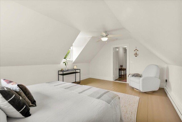 276 N Sedgwick Rd, Sedgwick, ME 04676 - bedroom with light wood-style flooring, vaulted ceiling, and a ceiling fan